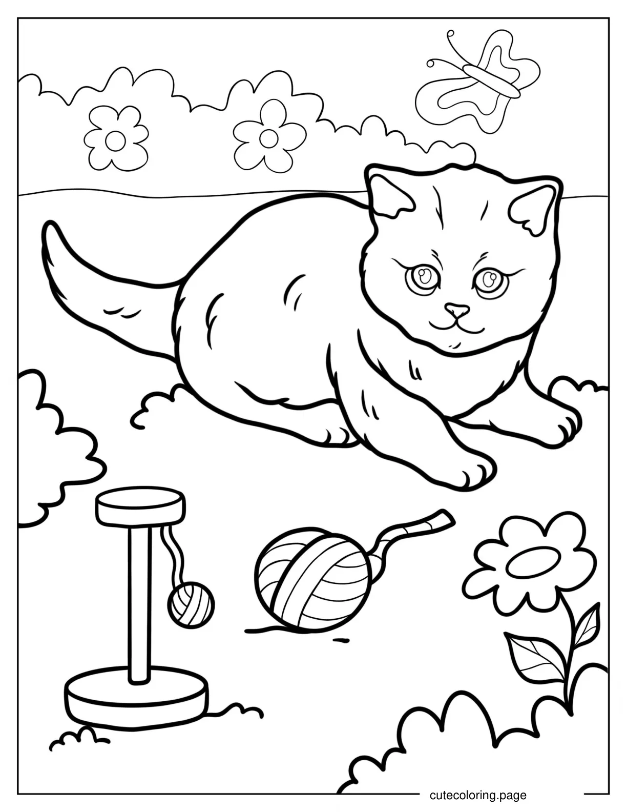 Kitten Laying On The Grass With Toys coloring page