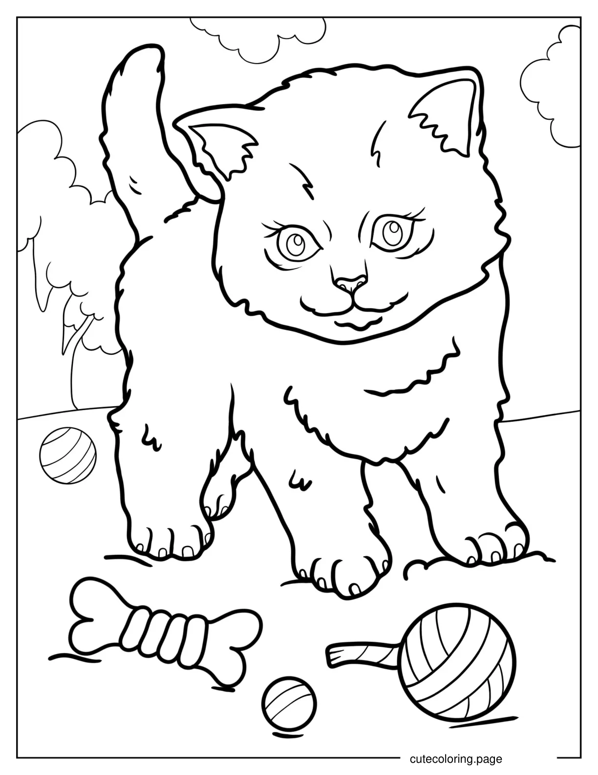 Kitten Playing In The Grass With Toys coloring page